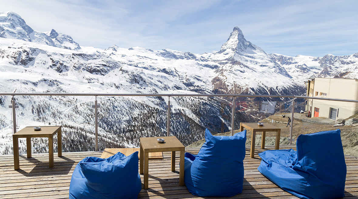 Ski resort bar with blue beanbags overlooking the Matterhorn